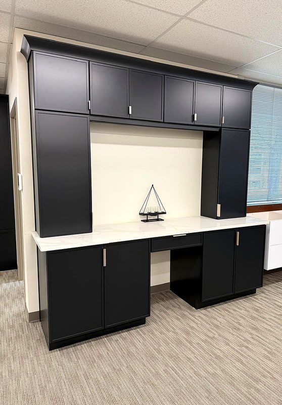 Charcoal black slim-shaker built-in desk and hutch wall unit with crown molding, white — on display at MNK Cabinet's Norcross, GA showroom