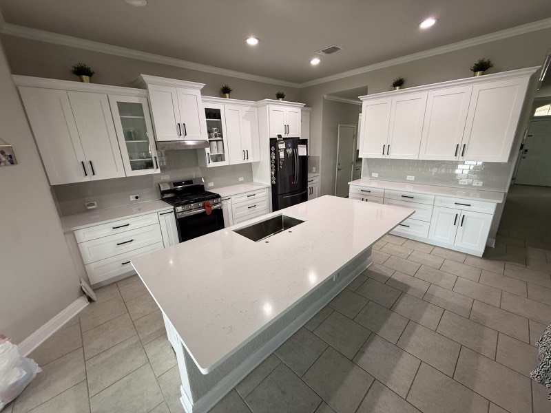 Bright white shaker kitchen with island installed by MNK Cabinet in metro Atlanta