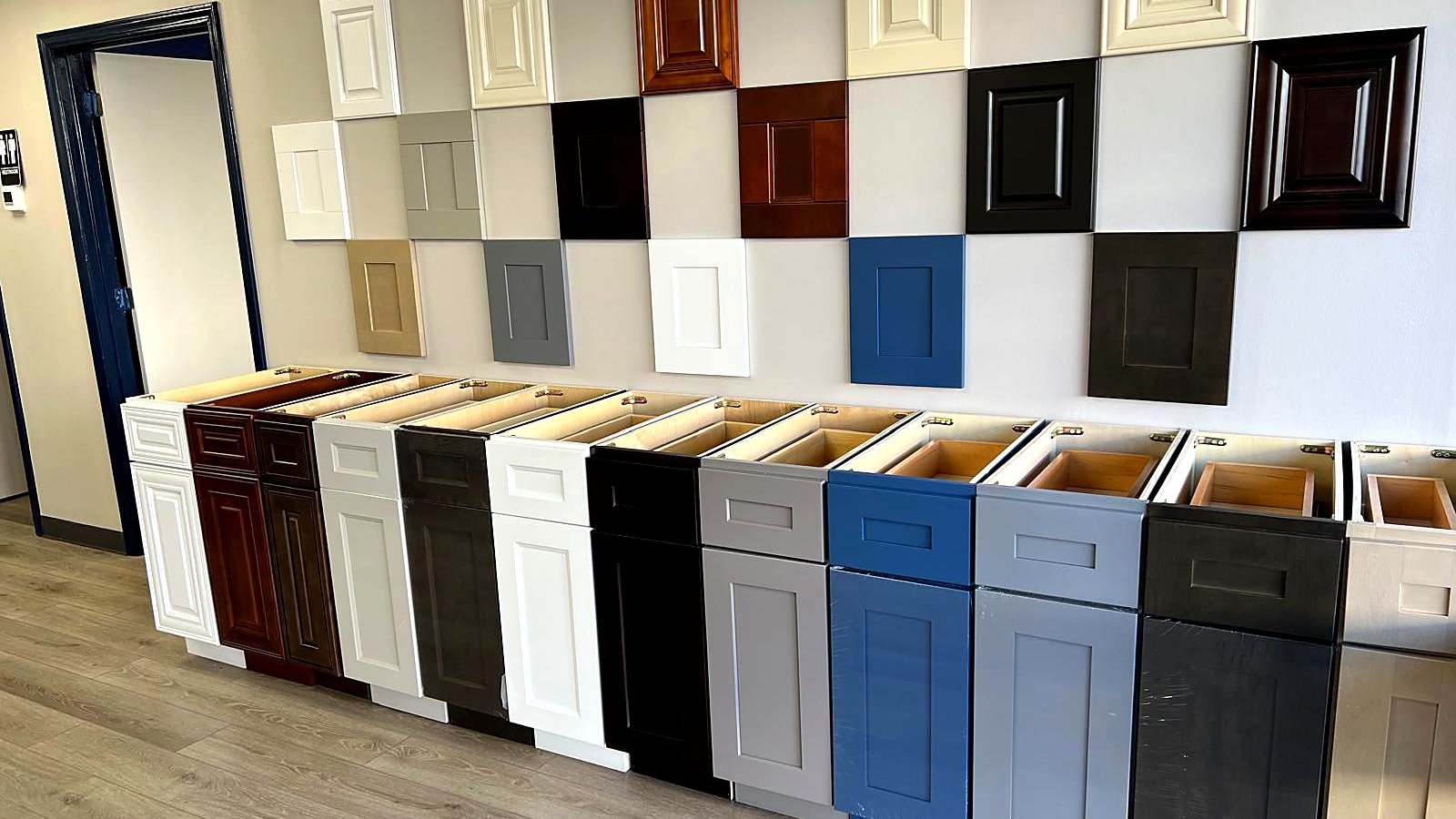 Cabinet door styles and finish samples on display at the MNK Cabinet showroom in Norcross, GA